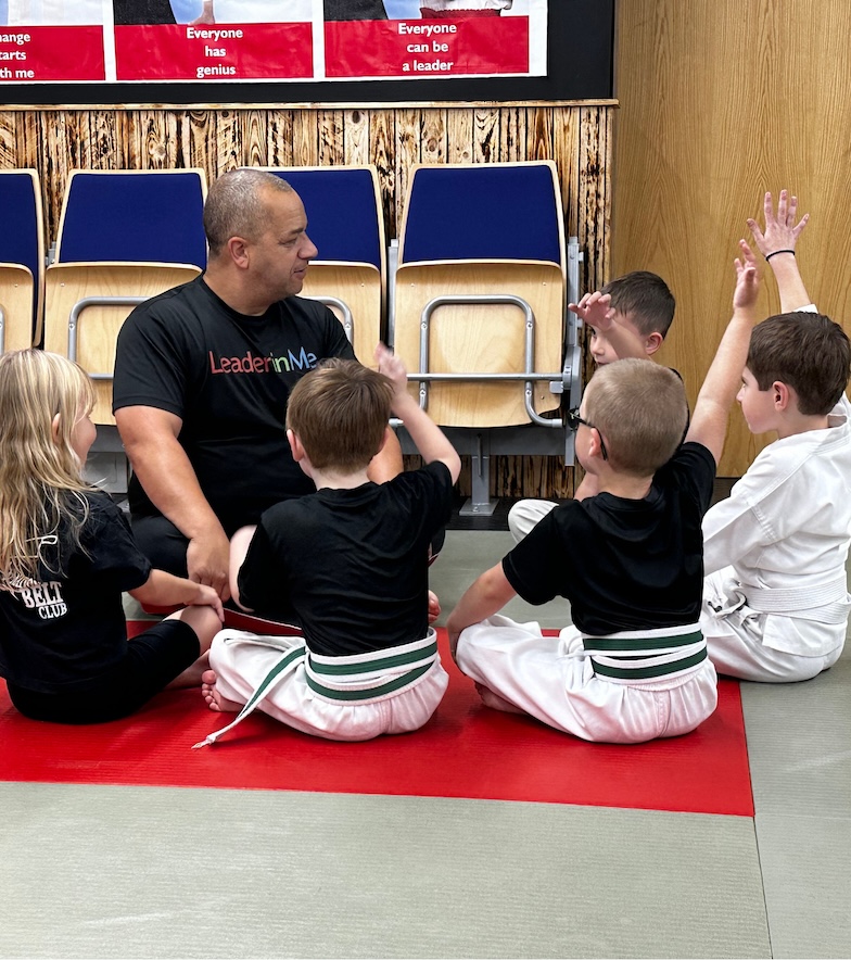 Kids martial arts mat chat at Kicx Academy Gloucester—children learning focus and confidence