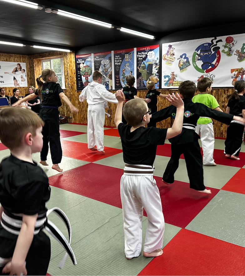 Kids martial arts warm-up at Kicx Academy Gloucester—Sharpen the Saw habit for fitness and fun