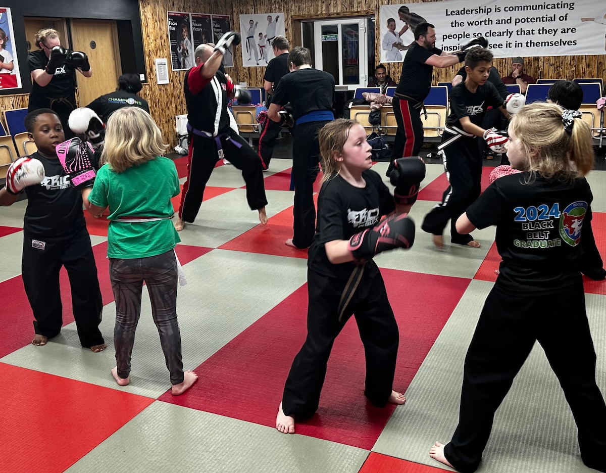 Family martial arts class at Kicx Academy Gloucester—children, parents, and adults training together in a supportive, fun environment