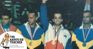 Stephen Thompson, World Karate Champion from Gloucester, standing on the podium. At Kicx Academy, children learn real martial arts from a world champion while also gaining confidence, focus, and life skills through the 7 Habits programme