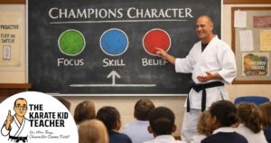 Karate instructor teaching Champions Character in a primary school classroom, explaining Focus, Skill and Belief to children as part of a proactive PSHE lesson