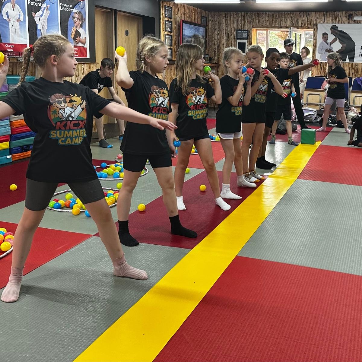 Children playing a team ball game during Kicx Summer Camp in Gloucester.